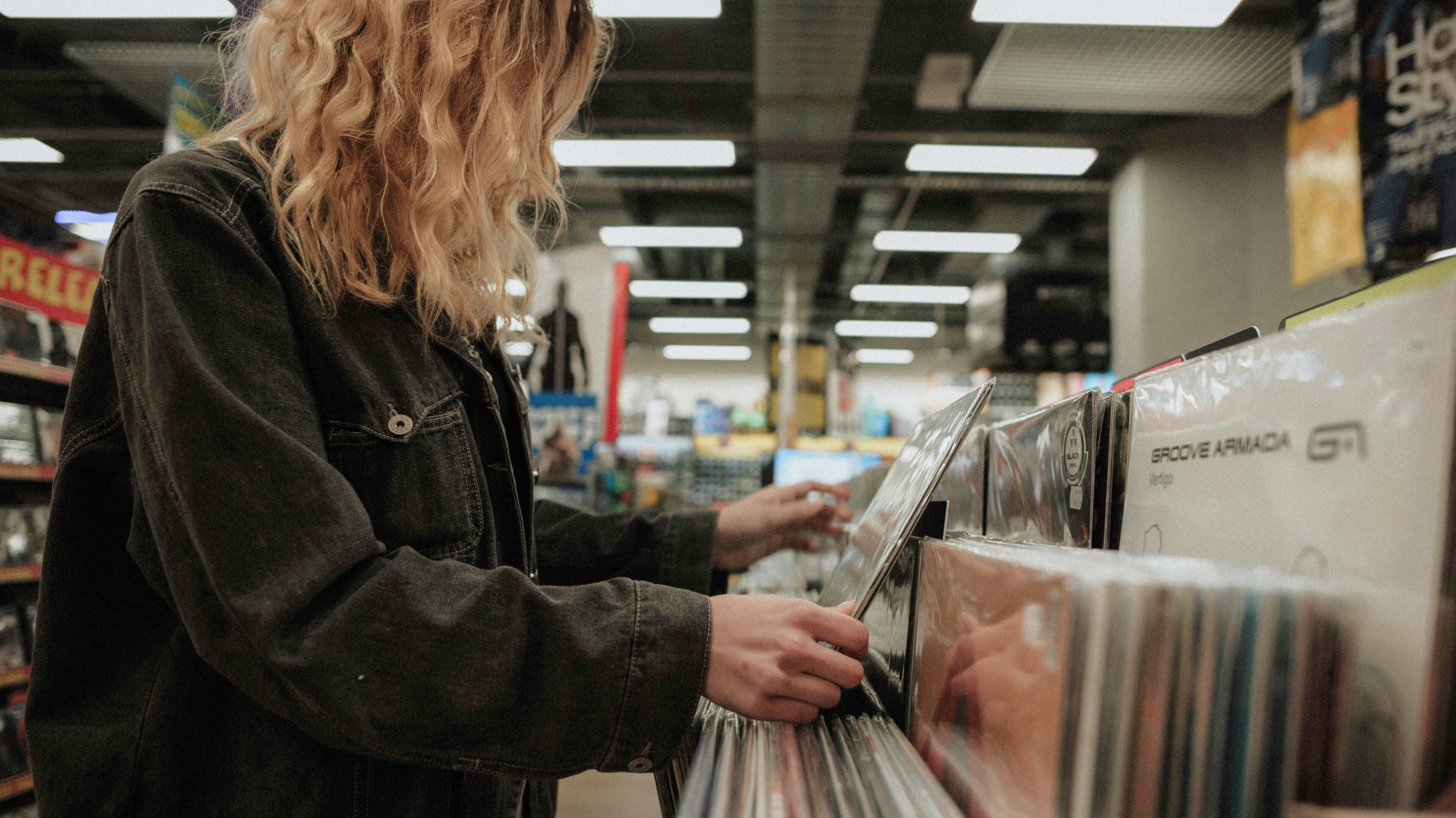 Vinyl records are sorted by genre, as shown here, in a classic record store
